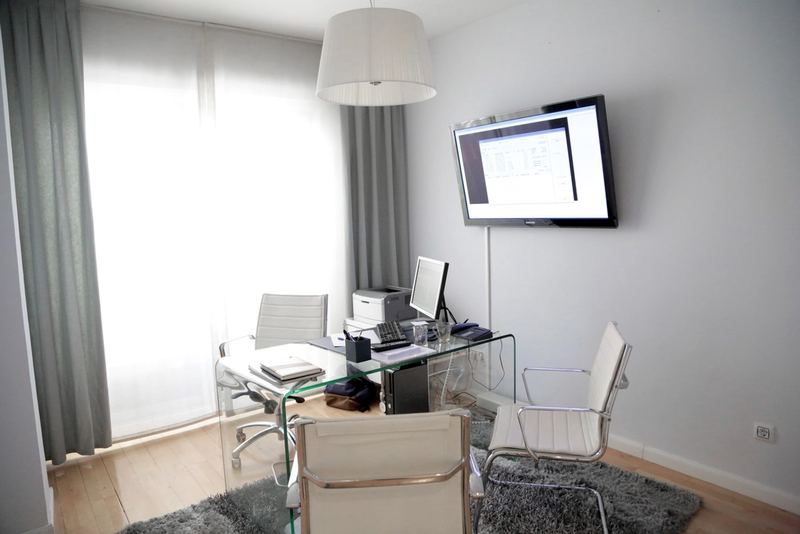 Tidy office workspace with clean desk and floors